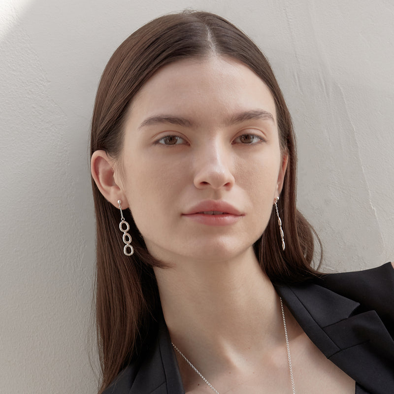 Model wearing Moyoura Connected Ovals Drop Earrings