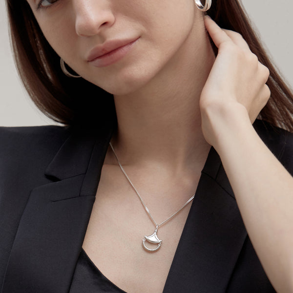 Model wearing Moyoura Chandelier Pendant Silver Necklace with Silver Hoops