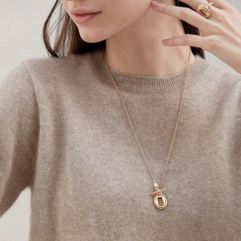 Model wearing Moyoura Key Hole Pendant Gold Necklace and Key Hole Gold Ring