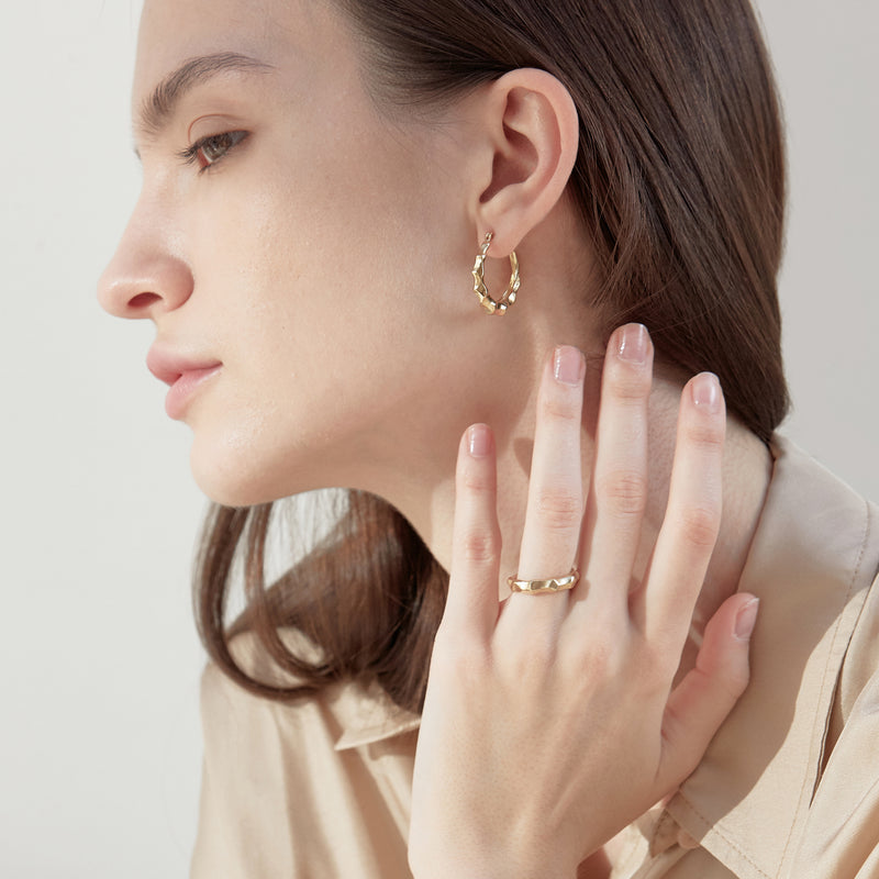 Model wearing Moyoura Natural Wave Gold Hoop Earrings and Gold Ring