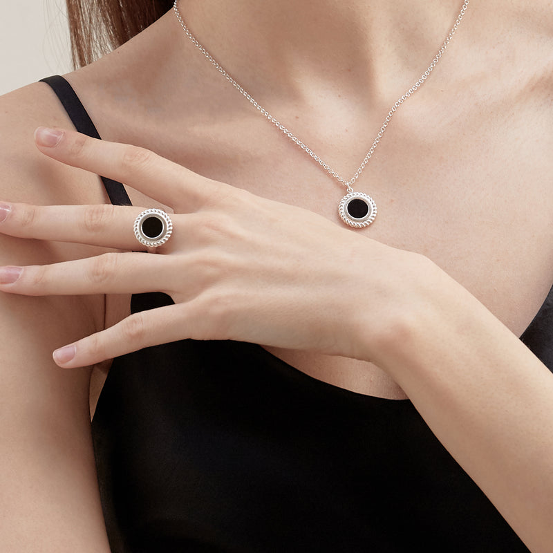 Model wearing Moyoura Onyx Circle Silver Necklace and Silver Ring